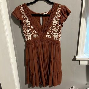 Burnt orange v neck dress with white floral detailing